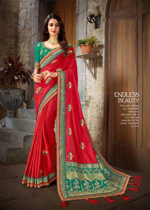 Celebrate This Festive Season With Beauty And Comfort Wearing This Designer Saree In Red Color Paired With Contrasting Sea Green Colored Blouse. This Saree And blouse Are Art Silk Based Beautified With Embroidery And Jacquard Silk Fabricated Pallu. 