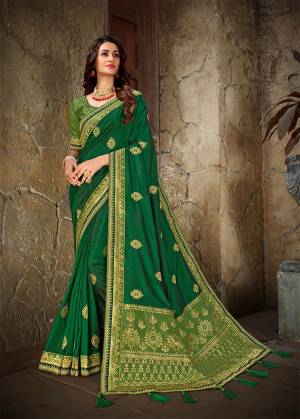 Celebrate This Festive Season With Beauty And Comfort Wearing This Designer Saree In Green Color Paired With Light Green Colored Blouse. This Saree And blouse Are Art Silk Based Beautified With Embroidery And Jacquard Silk Fabricated Pallu. 