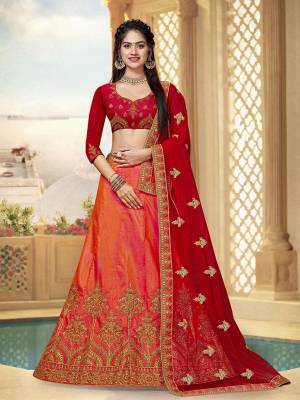 This Wedding Season, Catch All The Limelight Wearing This Designer Lehenga Choli In Red Colored Blouse Paired With Orange Colored Lehenga And Red Colored Dupatta. Its Blouse And Lehenga Are Fabricated On Art Silk Paired With Net Fabricated Dupatta. Buy This Attractive Piece Now. 