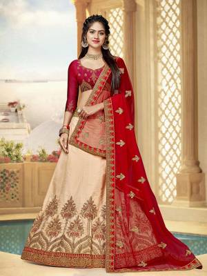 This Wedding Season, Catch All The Limelight Wearing This Designer Lehenga Choli In Red Colored Blouse Paired With Peach Colored Lehenga And Red Colored Dupatta. Its Blouse And Lehenga Are Fabricated On Art Silk Paired With Net Fabricated Dupatta. Buy This Attractive Piece Now. 