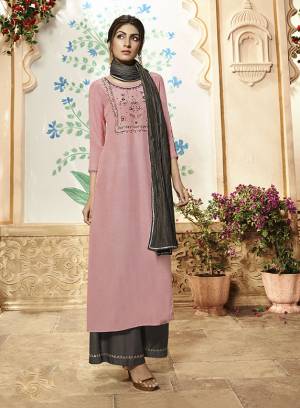 Look Pretty In This Designer Readymade Suit In Pink Colored Top Paired With Contrasting Dark Grey Colored Bottom And Dupatta. Its Embroiderd Top Is Fabricated On Viscose Rayon Paired With Readymade Muslin Plazzo And Crush Muslin Dupatta. Its Fabrics Are Soft Towards Skin And Easy To Carry All Day Long. 