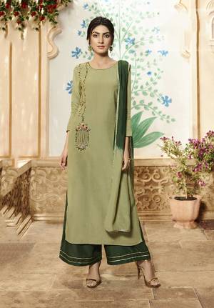 Go With The Shades Of Green Wearing This Designer Readymade Plazzo Suit In Light Olive Green And Dark Green Color. Its Pretty Embroidered Top Is Fabricated On Viscose Rayon Paired With Readymade Muslin Plazzo And Chinon Fabricated Shaded Dupatta. 