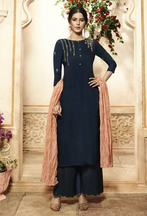 Enhance Your Personality Wearing This Designer Readymade Plazzo Suit In Navy Blue Color Paired With Contrasting Peach Colored Dupatta. Its Top Is Fabricated On Viscose Rayon Beautified With Embroidery Paired With Muslin Plazzo And Crush Muslin Dupatta. Its Rich Color Pallete Will Earn You Lots Of Compliments From Onlookers. 
