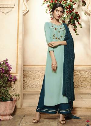 Here Is A Beautiful Designer Readymade Plazzo Suit In Shades Of Blue. Its Very Pretty Embroidered Top Is Fabricated On Viscose Rayon Paired With Readymade Muslin Fabricated Bottom Chinon Fabricated Dupatta. All Its Fabrics Are Light Weight, Durable And Easy To Care For. 