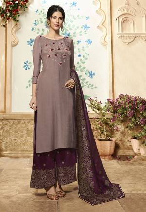 You Will Defintely Earn Lots Of Compliments Wearing This Readymade Designer Plazzo Suit In Muave Colored Top Paired With Contrasting Wine Colored Bottom And Dupatta. Its top Is Fabricated On Viscose Rayon Paired With Muslin Fabricated Plazzo And Dupatta. It Is Light Weight And Ensures Superb Comfort Throughout The Gala. 