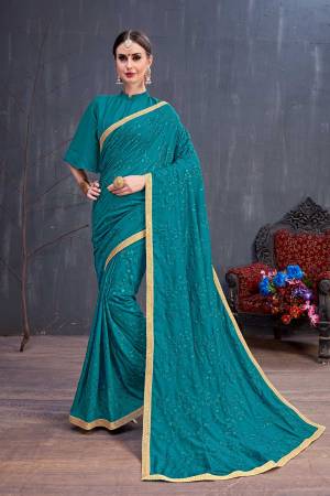 New Shade Is Here To Add Into Your Wardrobe With This Designer Saree In Teal Blue Color Paired With Teal Blue Colored Blouse. This Saree Is Fabricated On Georgette Beautified With Tone To Tone Resham Embroidery Paired With Art Silk Fabricated Blouse. 