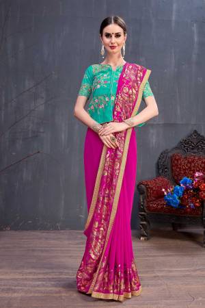 Shine Bright Wearing This Very Attractive Looking Designer Saree In Rani Pink Color Paired With Contrasting Sea Green Colored Blouse, This Saree Is Fabricated On Georgette Paired With Art Silk Fabricated Blouse. It Is Beautified With Rubber Foil Prints And Embroidery. 