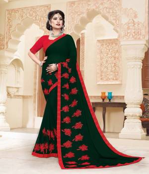 Grab This Very Pretty And Light Weight Designer Saree In Dark Green Color Paired With Contrasting Red Colored Blouse. This Saree Is Fabricated On Georgette Paired With Art Silk Fabricated Blouse. It Is Beautified With Thread Work Motif Giving An Attractive Look. 