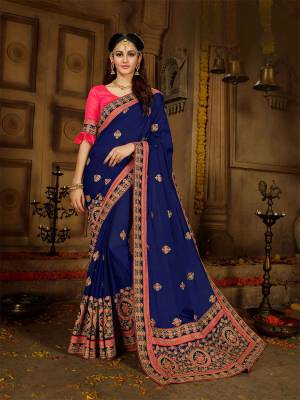 You Will Definitely Earn Lots Of Compliments Wearing This Heavy Designer Saree In Royal Blue Color Paired With Contrasting Fuschia Pink Colored Blouse. This Prettty Saree Is Fabricated On Georgette Paired With Art Silk Fabricated Blouse. Buy Now.