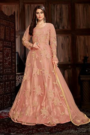 Look Beautiful In This Heavy Designer Floor Length Suit In All Over Peach Color. Its Heavy Embroiderded Top Is Fabricated On Net Paired With Santoon Bottom And Net Fabricated Dupatta. Its Top Is Beautified With Heavy Resham And Coding Work With Glitter Sequence Giving It An Attractive Look. 