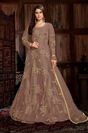 Look Beautiful In This Heavy Designer Floor Length Suit In All Over Sand Grey Color. Its Heavy Embroiderded Top Is Fabricated On Net Paired With Santoon Bottom And Net Fabricated Dupatta. Its Top Is Beautified With Heavy Resham And Coding Work With Glitter Sequence Giving It An Attractive Look. 