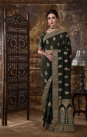 Enhance Your Personality In This Rich And Elegant Looking Heavy Designer Saree In Forest Green Color, This Heavy Embroidered Saree And Blouse Are Fabricated On Art Silk Beautified With Embroidery. Its Rich Fabric And Bold Color Will Earn You Lots Of Compliments From Onlookers. 