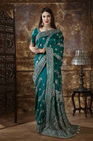 Enhance Your Personality In This Rich And Elegant Looking Heavy Designer Saree In Teal Blue Color, This Heavy Embroidered Saree And Blouse Are Fabricated On Art Silk Beautified With Embroidery. Its Rich Fabric And Unique Color Will Earn You Lots Of Compliments From Onlookers. 