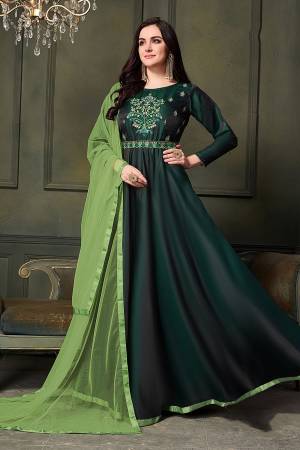 Go With The Shades Of Green Wearing This Designer Floor Length Suit In Pine Green Color Paired With Light Green Colored Dupatta. Its Top Is Fabricated On Satin Silk Paired With Santoon Bottom And Net Fabricated Dupatta. Buy This Suit Now.