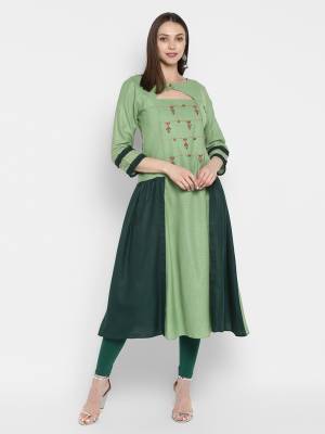 Here Is a Designer Readymade Kurti In Shades Of Green Color. This Kurti Is Silk Based Beautified With Thread Work Over The Yoke. 