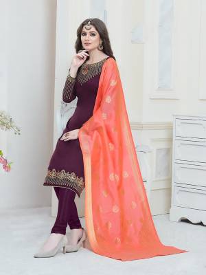 Here Is A Very Beautiful Designer Straight Suit In Wine Color Paired With Contrasting Orange Colored Dupatta. Its Embroiderded Top Is Fabricated On Satin Georgette Paired With Santoon Bottom And Banarasi Art Silk Dupatta. Buy This Attractive Suit Now.