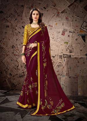 Elegant Designer Saree Is Here In Heavy Blouse Concept In Wine Colored Saree Paired With Contrasting Musturd Yellow Colored Blouse. This Printed Saree Is Fabricated On Satin Georgette Paired With Cotton Slub Fabricated Embroidered Blouse. 