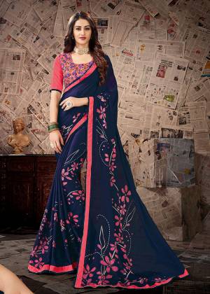 Grab This Very Beautiful Designer Saree In Blue Color Paired With Contrasting Pink Colored Blouse. Printed Saree Is Satin Georgette Based Paired With Cotton Slub Fabricated Heavy Embroidered Blouse. 