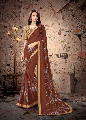 Simple and Elegant Looking Designer Printed Saree Is Here In Brown color Paired With Beige Colored Embroidered Blouse. This Saree Is Satin Georgette Based Paired With Cotton Slub Fabricated Blouse. Its Fabrics Are Light Weight And Easy To Carry All Day Long.