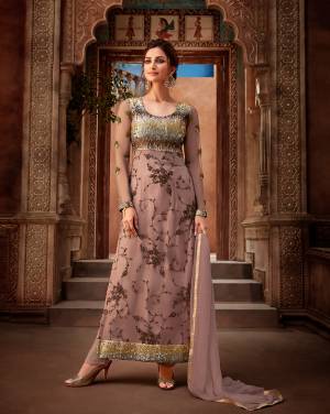 A Very Trendy English Color Is Here With This Designer Straight Suit In Mauve Color Paired With Mauve Colored Bottom And Dupatta. Its Embroidered Top Is Fabricated On Georgette Paired With Santoon Bottom And Chiffon Fabricated Dupatta. 