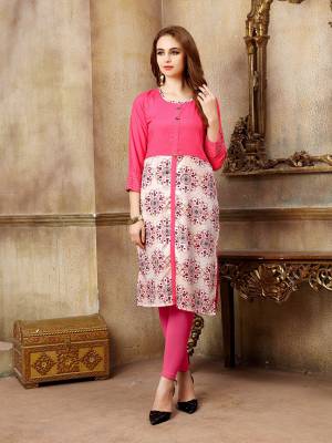 For Your Casual Wear, Grab This Readymade Kurti In Dark Pink Color Fabricated On Rayon Beautified With Prints. It Is Light In Weight And Available In All Sizes. 
