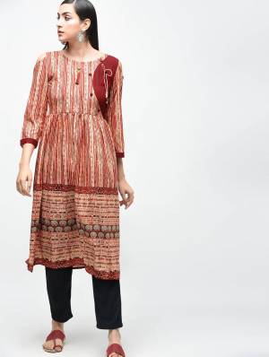 Add This Readymade Kurti For Your Semi-Casuals In Light Brown Color Which Is Cotton Based Beautified With Prints All Over. 