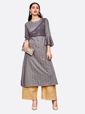 Here Is A Pretty Readymade Kurti To Add Into Your Wardrobe With This Designer Readymade Kurti In Grey Color Fabricated On Polyester Blend Beautified With Prints All Over. 