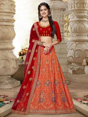 This Wedding Season, Catch All The Limelight Wearing This Designer Lehenga Choli In Red Colored Blouse Paired With Orange Colored Lehenga And Red Colored Dupatta. Its Blouse And Lehenga Are Fabricated On Art Silk Paired With Net Fabricated Dupatta. Buy This Attractive Piece Now