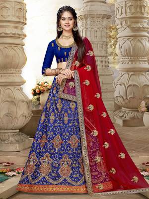 Look Beautiful Wearing This Heavy Designer Lehenga Choli In Royal Blue?Color Paired With Contrasting Red Colored Dupatta. This Lehenga And Choli Are Fabricated On Art Silk Paired With Net Fabricated Dupatta