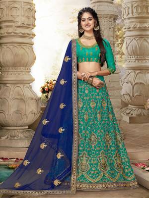 Look Beautiful Wearing This Heavy Designer Lehenga Choli In Sea Green?Color Paired With Contrasting Royal Blue Colored Dupatta. This Lehenga And Choli Are Fabricated On Art Silk Paired With Net Fabricated Dupatta