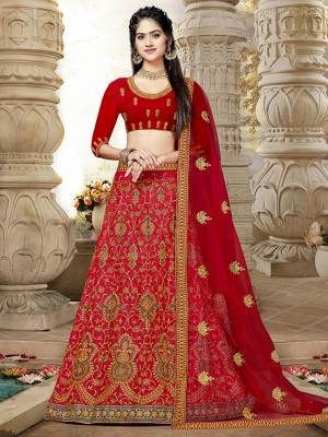 Catch All The Limelight At The Next Wedding You Attend Wearing This Very Beautiful Lehenga Choli In All Over Red Color. This Lehenga Choli Is Silk Based Paired With Net Fabricated Dupatta.