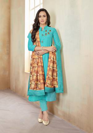 For Your Semi-Casuals Or Festive Wear, Grab This Readymade Suit With Fully Stitched Top And Unstitched Bottom. This Pretty Suit In Turquoise Blue Color Is Cotton Based Paired With Light Brown Colored Muslin Fabricated Digital Printed Dupatta. Its Fabrics Are Soft Towards Skin And Easy To Carry All Day Long. 