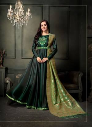 Go With The Shades Of Green Wearing This Designer Floor Length Suit In Pine Green Color Paired With Light Green Colored Dupatta. Its Top Is Fabricated On Satin Georgette Paired With Santoon Bottom And Banarasi Art Silk Dupatta. Buy This Suit Now