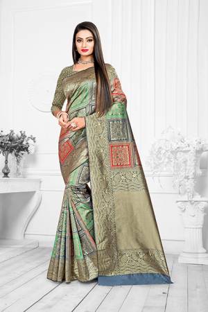 Here Is A Very Pretty Designer Silk Based For The Upcoming Festive Season. This Weaved Saree Is Fabricated On Banarasi art Silk Paired With Art Silk Fabricated Blouse. You Will Definitely Earn Lots Of Compliments In This Complete Traditional Look. 