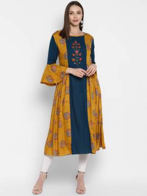 Grab This Very Beautiful Designer Readymade Kurti In Musturd Yellow And Blue Color Fabricated On Rayon. It Is Beautified With Prints And Thread Work. 