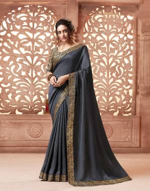 Celebrate This Festive Season With Beauty and Comfort Wearing This Designer Saree In Grey Color . This Saree Is Fabricated On Satin Silk Paired With Art Silk Fabricated Weave Blouse. It Is Beautified With Weave Lace Border Over The Saree. Buy Now.