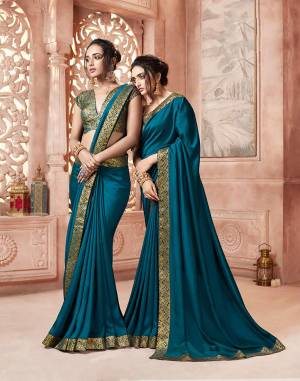 Celebrate This Festive Season With Beauty and Comfort Wearing This Designer Saree In Blue Color . This Saree Is Fabricated On Satin Silk Paired With Art Silk Fabricated Weave Blouse. It Is Beautified With Weave Lace Border Over The Saree. Buy Now.
