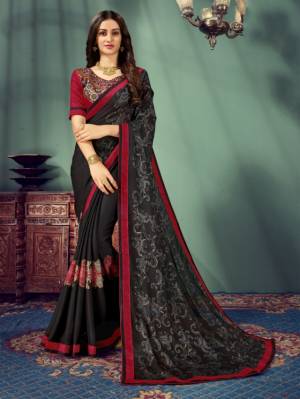 For A Bold and Beautiful Look, Grab This Designer Saree In Black Color Paired With Maroon Colored Blouse. This Saree Is Fabricated On Chiffon Paired With Art Silk Fabricated Blouse. Buy This Lovely Saree Now.