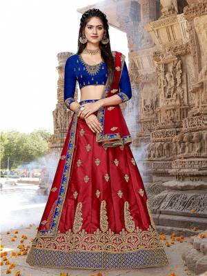 Grab This Attractive Looking Designer Lehenga Choli In Royal Blue Colored Blouse Paired With Contrasting Red Colored Colored Lehenga And Dupatta. Its Blouse And Lehenga Are Fabricated On Art Silk Paired With Net Fabricated Dupatta. It Is Beautified With Heavy Embroidery All Over. 