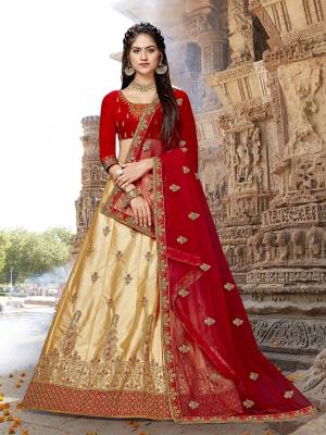 Evergreen Combination Is Here With This Heavy Designer Lehenga Choli In Red Colored Blouse Paired With Beige Colored lehenga And Red Colored Dupatta. This Silk Based Lehenga Choli Gives A Rich Look To Your Personality. 