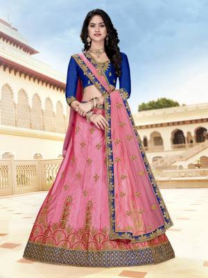 Look Pretty In This Heavy Designer Lehenga Choli In Royal Blue Color Paired With Contrasting Pink Colored Lehenga And Dupatta. Its Blouse And Lehenga Are Fabricated On Art Silk Paired With Net fabricated Dupatta. Buy Now.