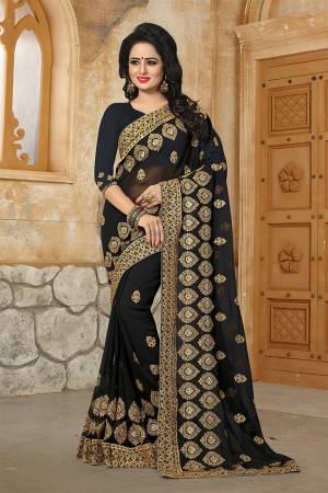 Grab This Very Beautiful And Attractive Looking Heavy Designer Saree In Black Color. This Saree And Blouse Are Fabricated On Georgette Beautified With Heavy Jari Embroidery & Stone Work. Buy Now.
