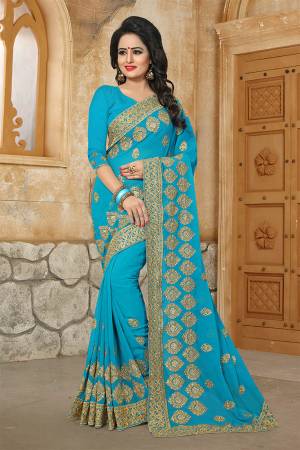 Grab This Very Beautiful And Attractive Looking Heavy Designer Saree In Blue Color. This Saree And Blouse Are Fabricated On Georgette Beautified With Heavy Jari Embroidery & Stone Work. Buy Now.
