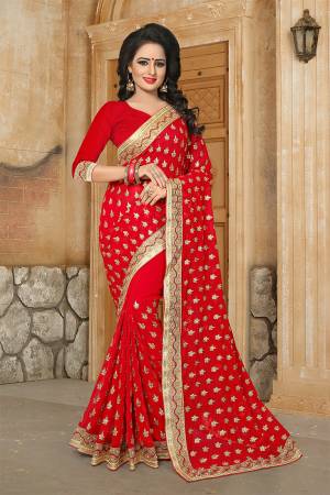 Here Is A Very Pretty Designer Saree For The Upcoming Festive And Wedding Season In Red. This Saree And Blouse are Fabricated On Georgette Beautified With Butti All Over With Jari Embroidery Highlighted With Stone And Pearl Work. 
