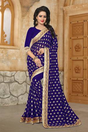 Here Is A Very Pretty Designer Saree For The Upcoming Festive And Wedding Season In Royal Blue. This Saree And Blouse are Fabricated On Georgette Beautified With Butti All Over With Jari Embroidery Highlighted With Stone And Pearl Work. 