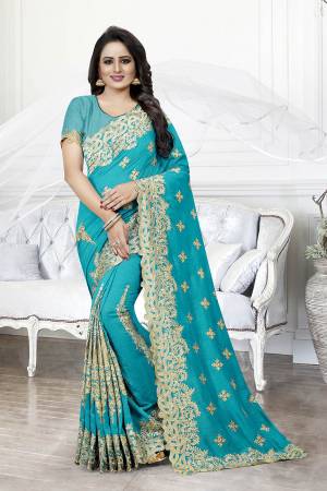 Get Ready For The Upcoming Wedding Season With This Heavy Designer Saree In Blue Color. This Saree And Blouse are Silk Based Beautified With Heavy Embroidery With Cut Work. This Saree Is Suitable For Wedding And Festive Wear. Buy This Heavy Attractive Saree Now.