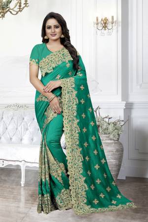 Get Ready For The Upcoming Wedding Season With This Heavy Designer Saree In Green Color. This Saree And Blouse are Silk Based Beautified With Heavy Embroidery With Cut Work. This Saree Is Suitable For Wedding And Festive Wear. Buy This Heavy Attractive Saree Now.