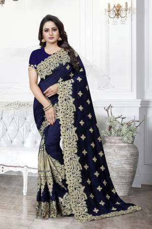 Get Ready For The Upcoming Wedding Season With This Heavy Designer Saree In Navy Blue Color. This Saree And Blouse are Silk Based Beautified With Heavy Embroidery With Cut Work. This Saree Is Suitable For Wedding And Festive Wear. Buy This Heavy Attractive Saree Now.