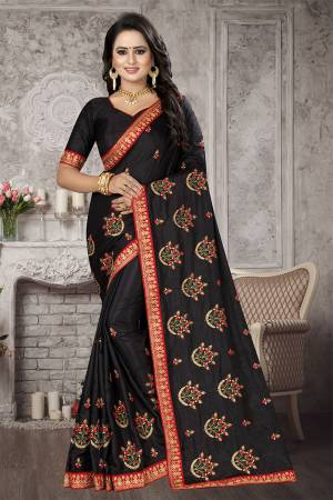 Bold Shade Is Here To Add Into Your Wardrobe With This Designer Saree In Black Color. This Saree And Blouse are Satin Silk Based With Embroidered Motifs All Over. 
