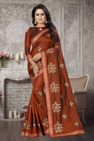 Add This Designer Saree To Your Wardrobe In Brown color Fabricated On Satin Silk, Its Pretty Embroidered Motifs And Rich Silk Fabric Will Earn You Lots Of Compliments From Onlookers. 